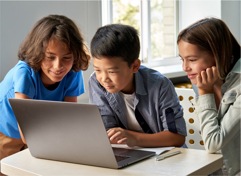 A group of students learning about AI and technology in a classroom setting.